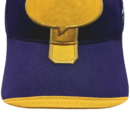 Photo of fabric applique on the upper visor of a cap, with the fabric covering just the front edge of the visor