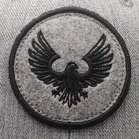 Photo of a logo embroidered on a fabric patch