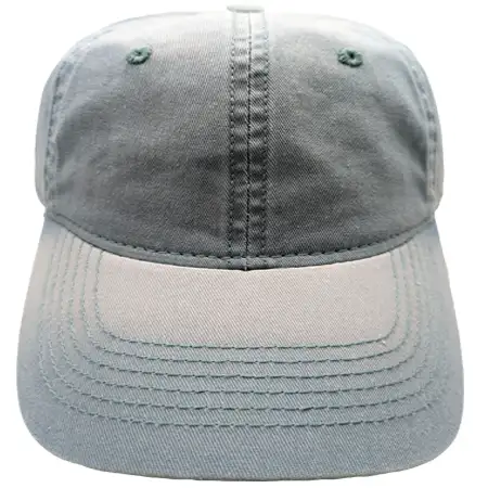 Photo of a cap that has been put through a bleach wash, with a good deal of fading throughout the fabric, especially on the edges and seams